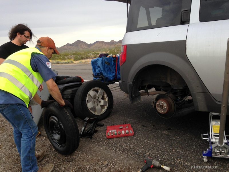 AAA Changing a tire on the highway